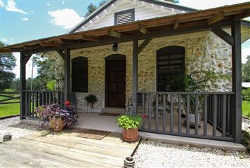 Front Porch of the Stone Home of the Farm for Sale